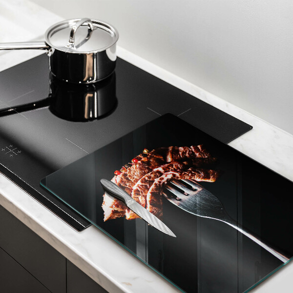 Glas Ceranfeldabdeckung Fleisch auf einer Gabel