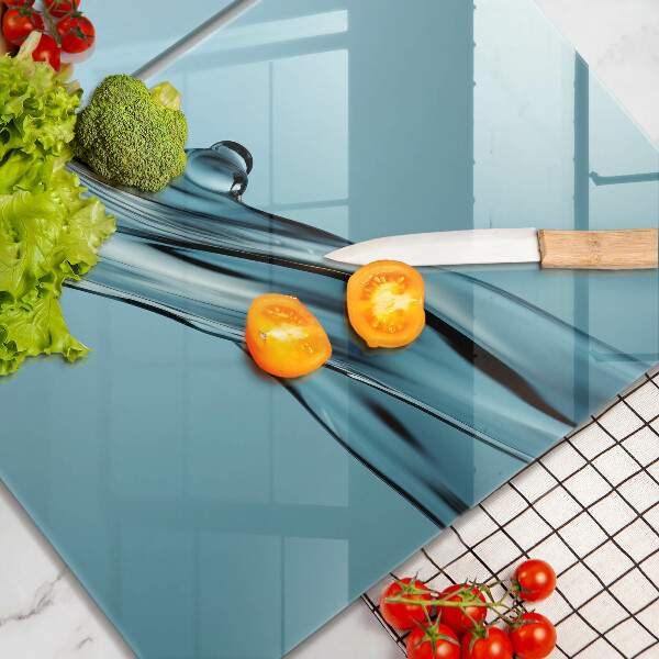 Glas Ceranfeldabdeckung Wasser auf blauem Hintergrund