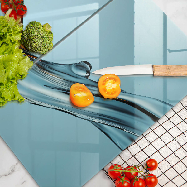 Glas Ceranfeldabdeckung Wasser auf blauem Hintergrund