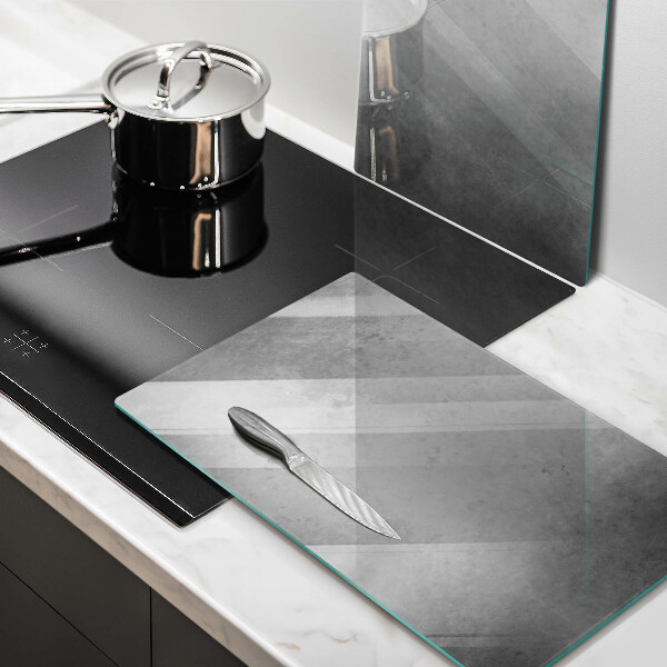 Glas Herdabdeckplatte Betonbeschaffenheitshintergrund