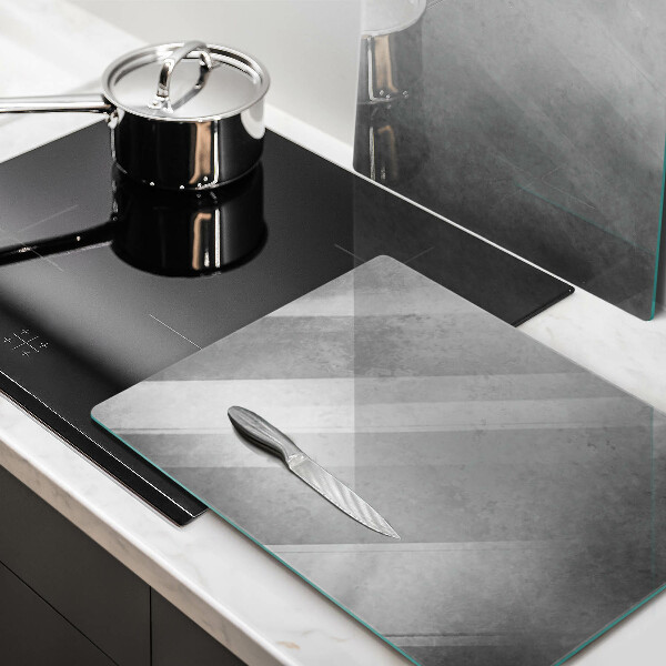 Glas Herdabdeckplatte Betonbeschaffenheitshintergrund