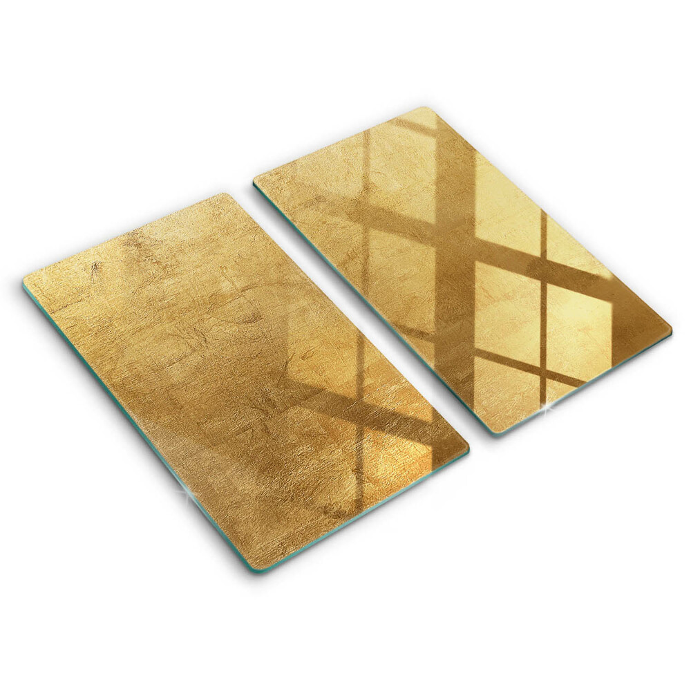 Glas Herdabdeckplatte Goldbeschaffenheitshintergrund