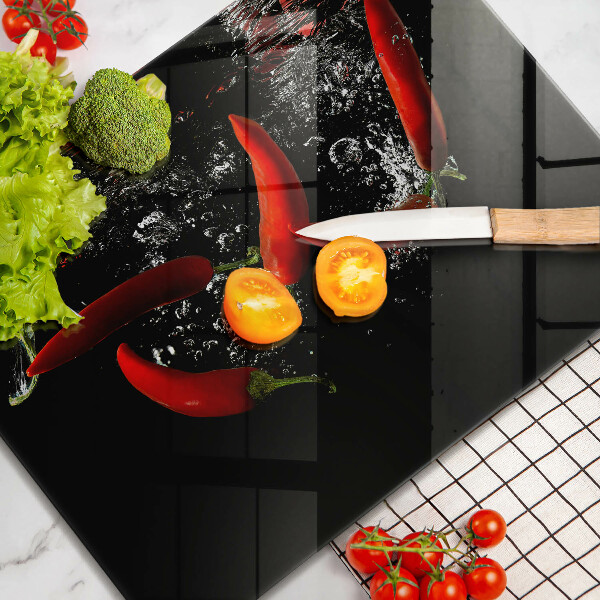 Glas Herdabdeckplatte Chilischoten in Wasser