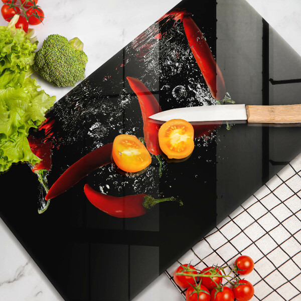 Glas Herdabdeckplatte Chilischoten in Wasser