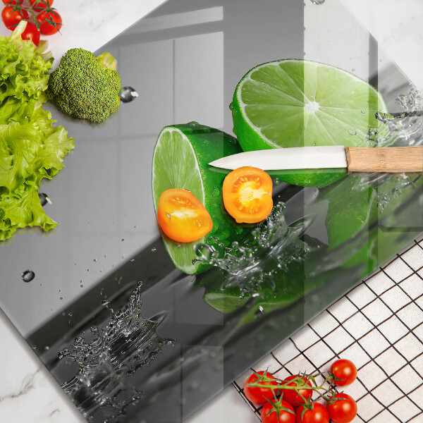 Glas Herdabdeckplatte Saftige Limetten und Wasser