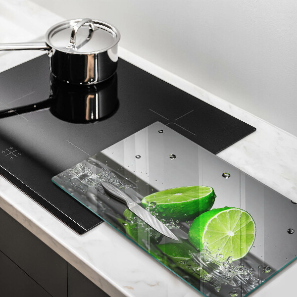Glas Herdabdeckplatte Saftige Limetten und Wasser