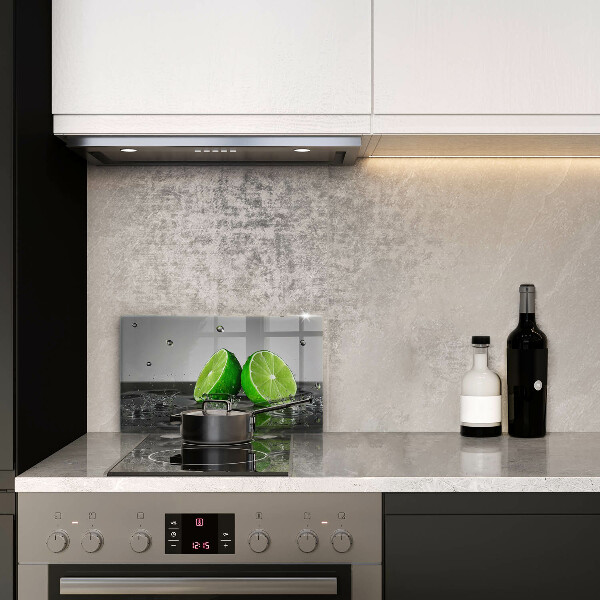 Glas Herdabdeckplatte Saftige Limetten und Wasser