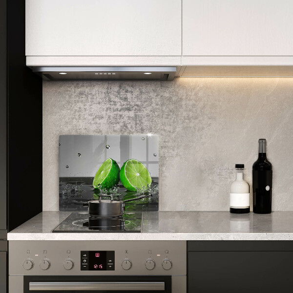 Glas Herdabdeckplatte Saftige Limetten und Wasser