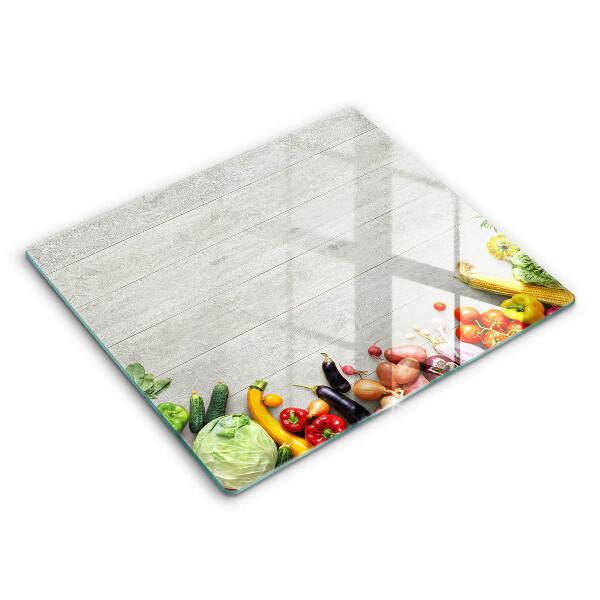 Glas Ceranfeldabdeckung Gemüse auf Brettern