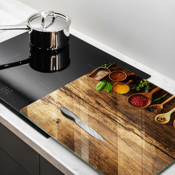 Glas Herdabdeckplatte Holzlöffel mit Gewürzen