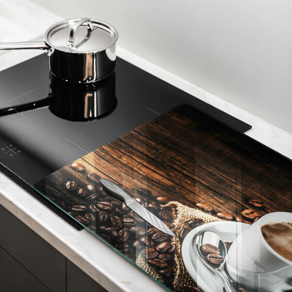 Glas Ceranfeldabdeckung Tasse und Kaffeebohnen