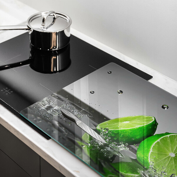 Glas Herdabdeckplatte Saftige Limetten und Wasser
