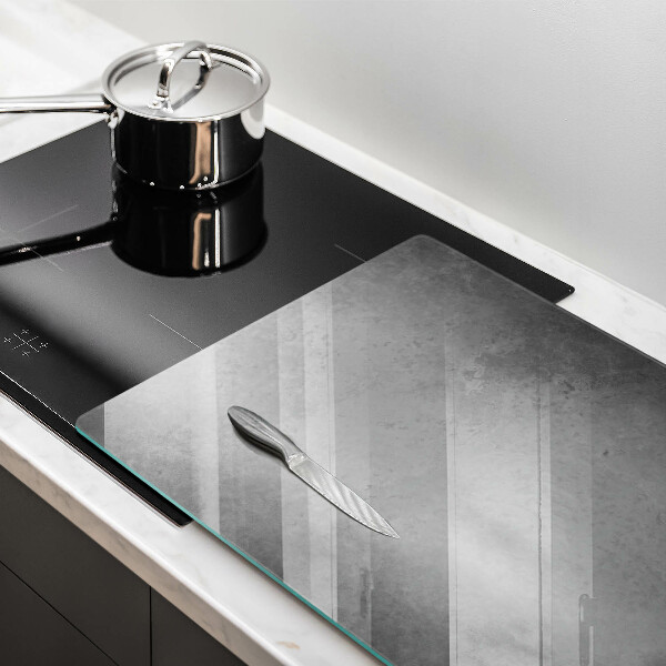 Glas Herdabdeckplatte Betonbeschaffenheitshintergrund