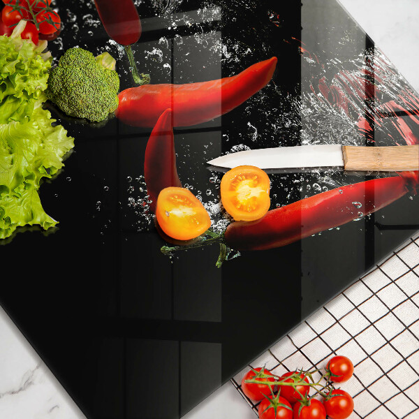 Herdplattenabdeckung Chilischoten in Wasser