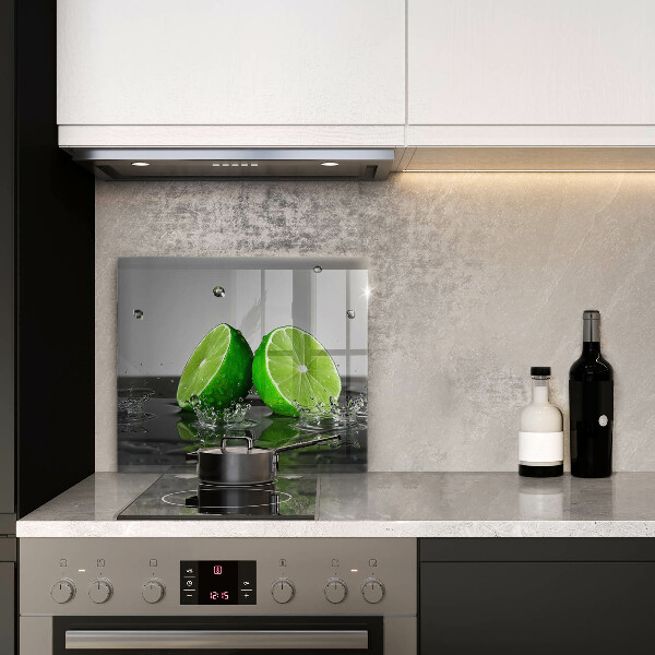 Herdplattenabdeckung Saftige Limetten und Wasser