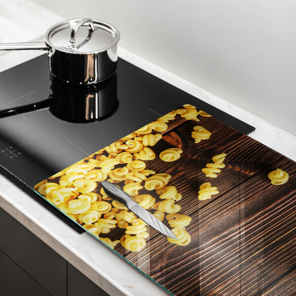 Herdabdeckplatte glas Nudeln auf dem Tisch