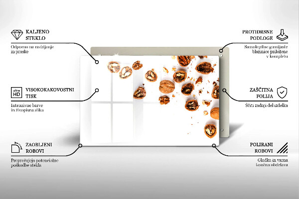 Herdabdeckplatte glas Nüsse auf weißem Hintergrund