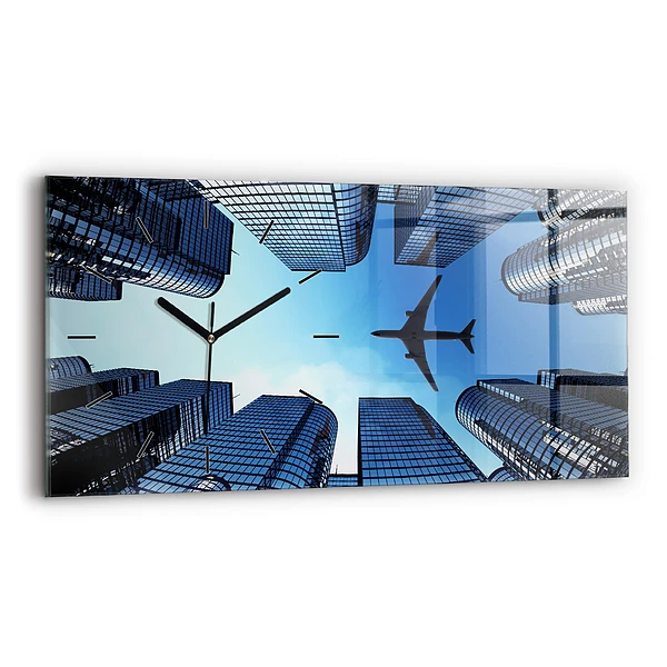 Horizontale Uhr mit motiv Flugzeug über Gebäuden