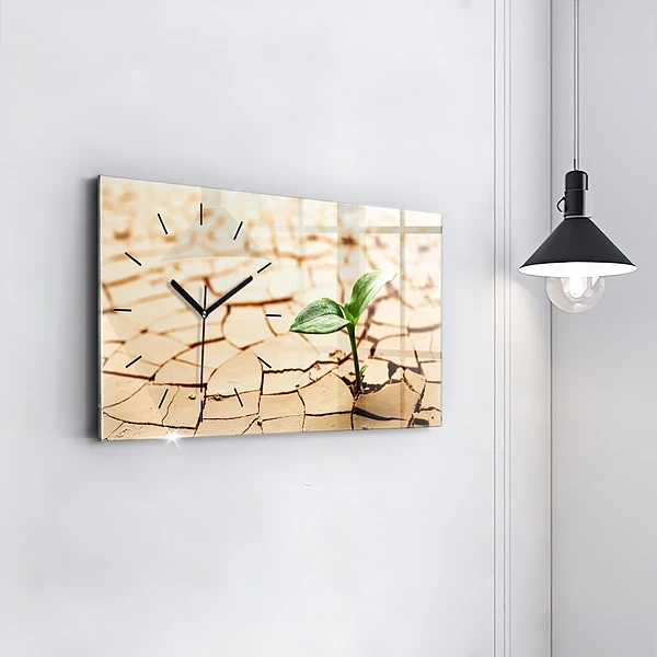 Horizontale Uhr mit motiv Pflanze in getrockneter Erde