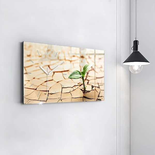 Horizontale Uhr mit motiv Pflanze in getrockneter Erde