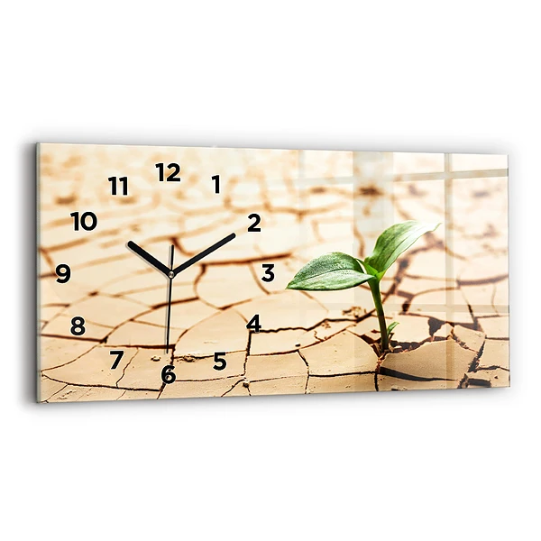 Horizontale Uhr mit motiv Pflanze in getrockneter Erde