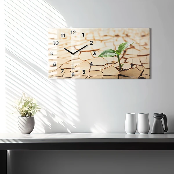 Horizontale Uhr mit motiv Pflanze in getrockneter Erde