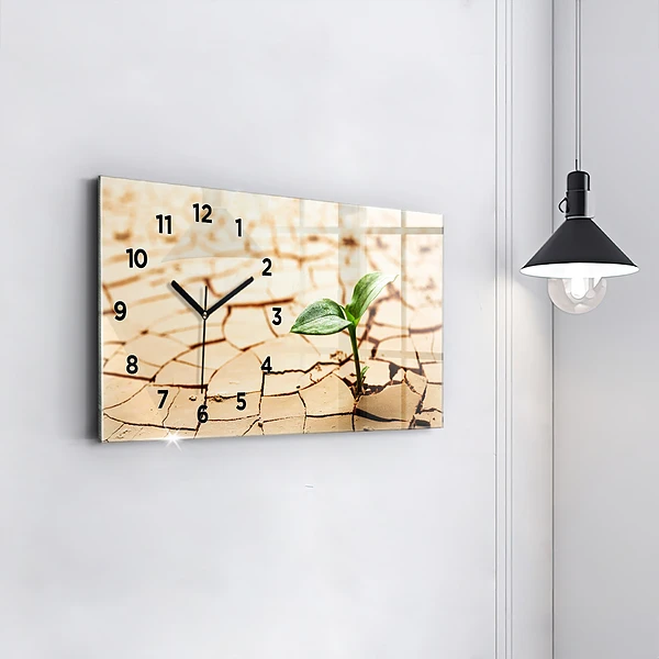 Horizontale Uhr mit motiv Pflanze in getrockneter Erde