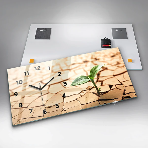 Horizontale Uhr mit motiv Pflanze in getrockneter Erde