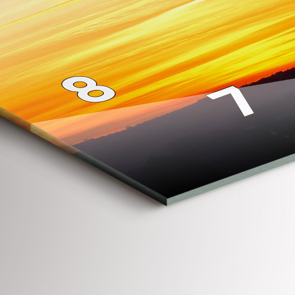 Horizontale Uhr Gebäude und Sonnenuntergang