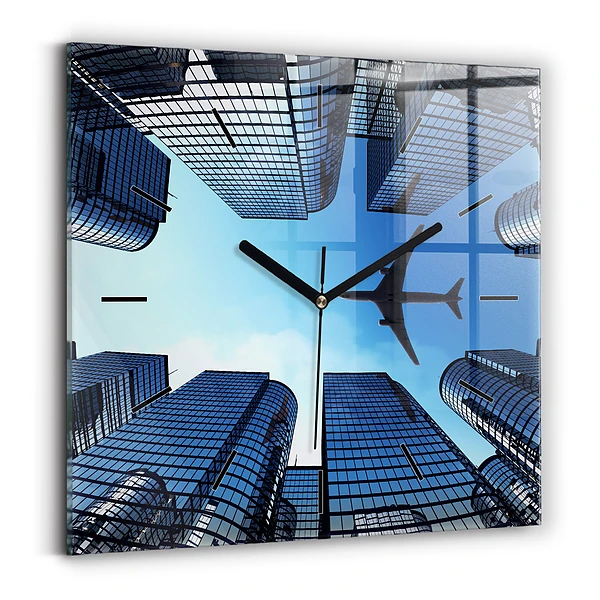 Wanduhr quadratisch mit motiv Flugzeug über Gebäuden