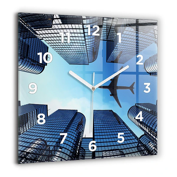 Wanduhr quadratisch mit motiv Flugzeug über Gebäuden