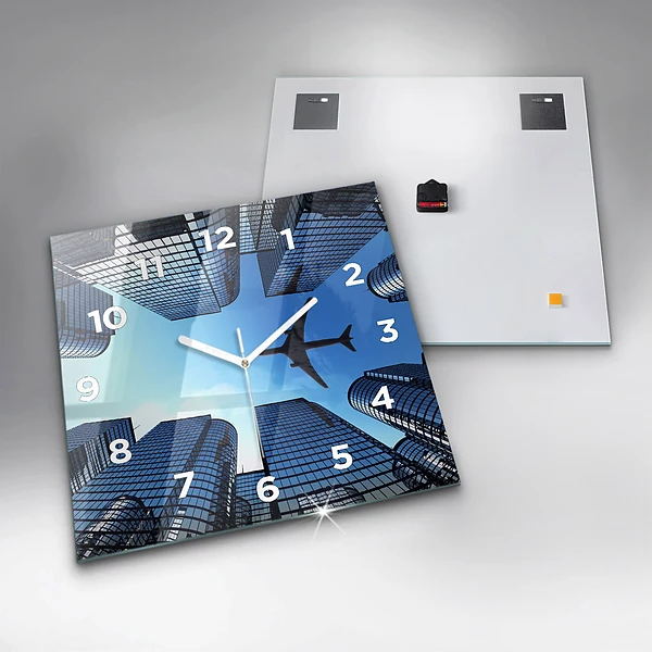 Wanduhr quadratisch mit motiv Flugzeug über Gebäuden