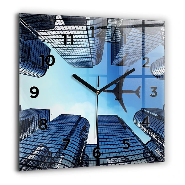 Wanduhr quadratisch mit motiv Flugzeug über Gebäuden