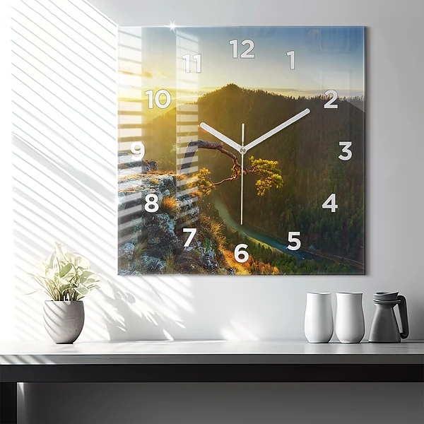 Wanduhr quadratisch mit motiv Sonnenuntergang über den Bergen
