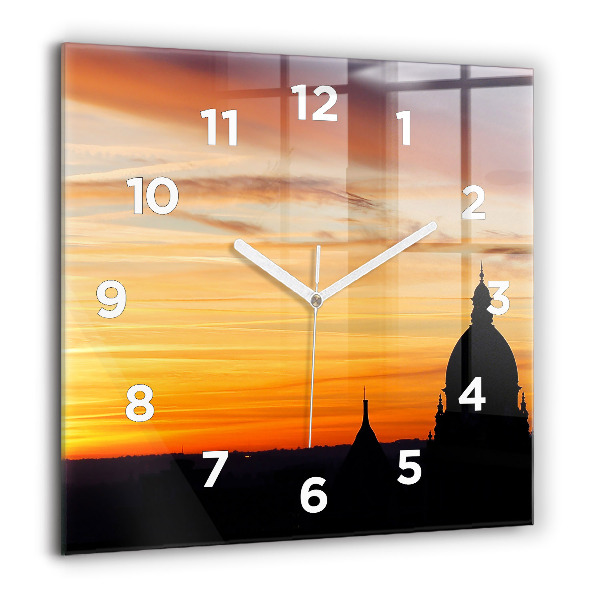 Wanduhr modern quadratisch Gebäude und Sonnenuntergang
