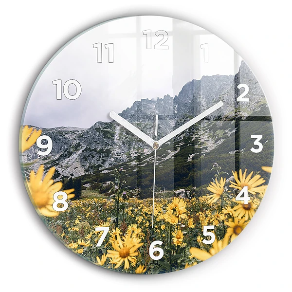 Wanduhr rund Blumenwiese in den Bergen