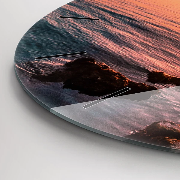 Wanduhr glas rund Felsen bei Sonnenuntergang