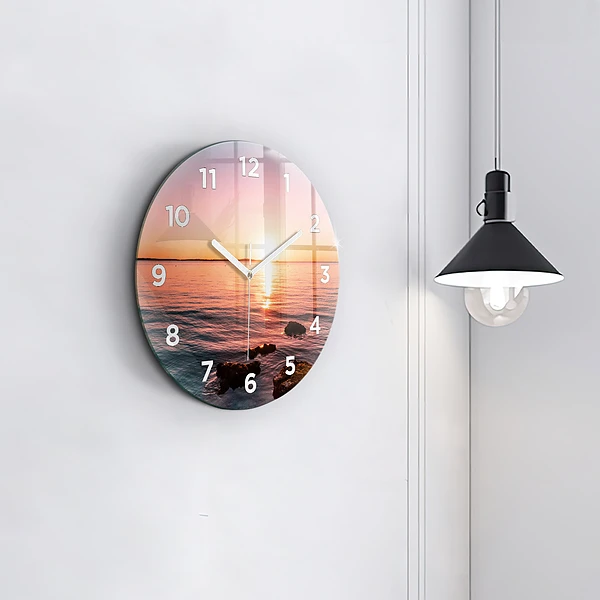 Wanduhr glas rund Felsen bei Sonnenuntergang