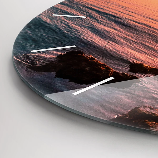 Wanduhr glas rund Felsen bei Sonnenuntergang