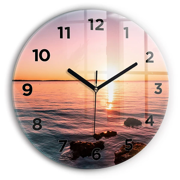 Wanduhr glas rund Felsen bei Sonnenuntergang