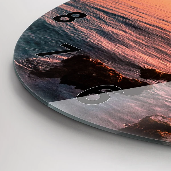 Wanduhr glas rund Felsen bei Sonnenuntergang
