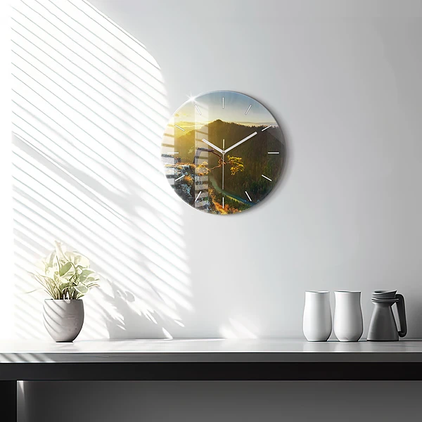 Wanduhr glas rund Sonnenuntergang über den Bergen