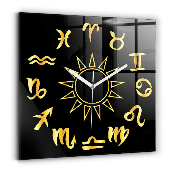 Wanduhr quadratisch mit motiv Goldene Sternzeichen auf schwarzem Hintergrund.